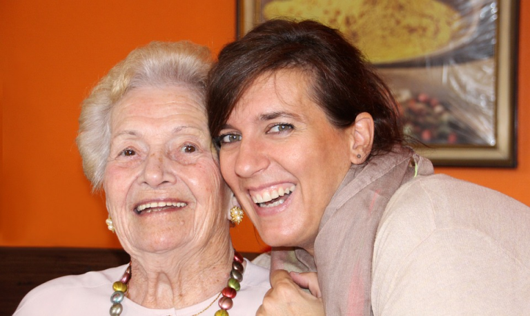 Resident smiling with visitor